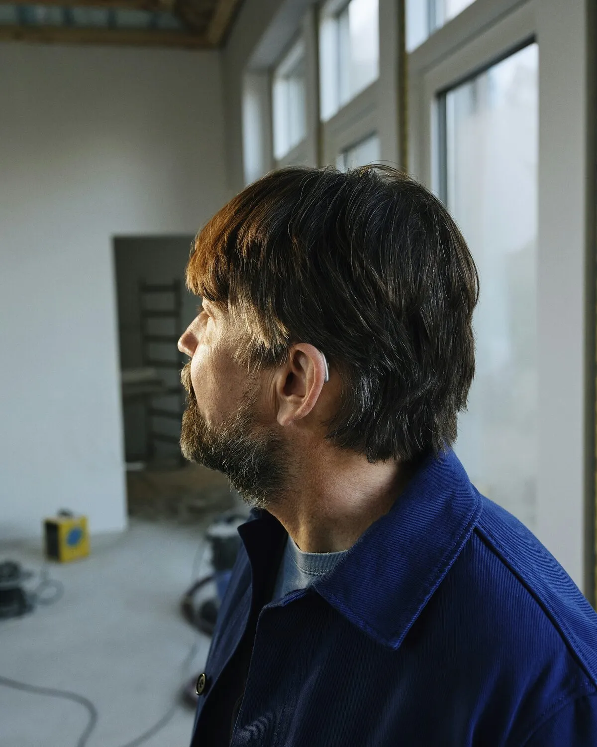 Dan Hale in his navy work jacket on a renovation job